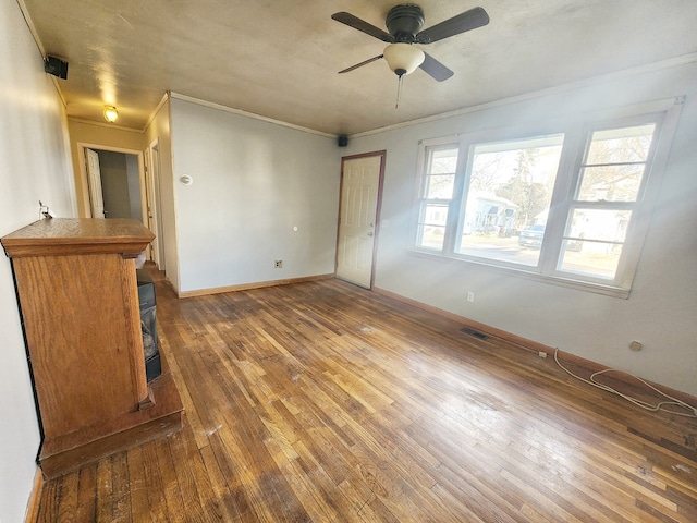 interior space featuring a closet, dark hardwood / wood-style floors, ceiling fan, and ornamental molding