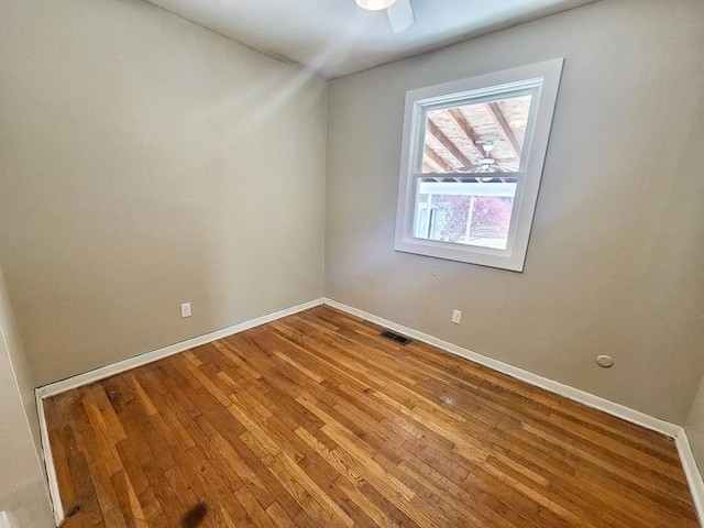 spare room with hardwood / wood-style flooring