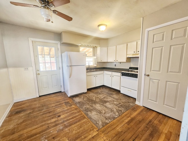 kitchen featuring white cabinets, dark hardwood / wood-style flooring, white appliances, and sink