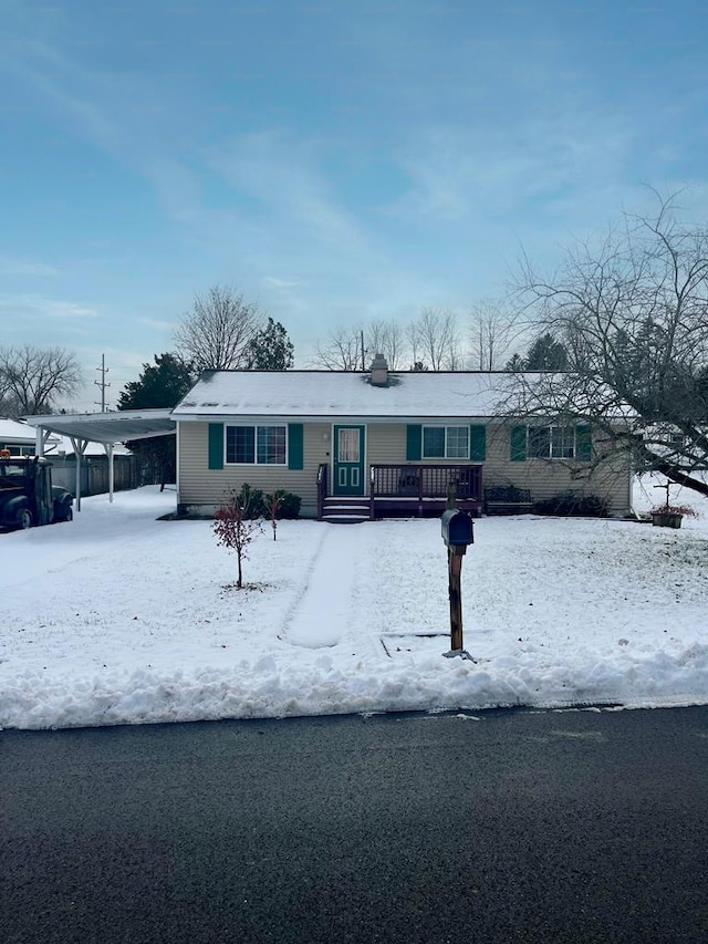 single story home featuring a carport