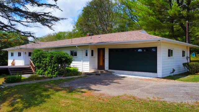 ranch-style house featuring a garage