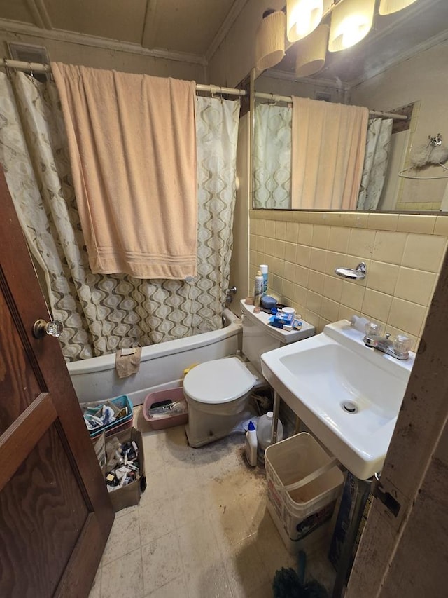 full bathroom featuring shower / tub combo, ornamental molding, sink, tile walls, and toilet