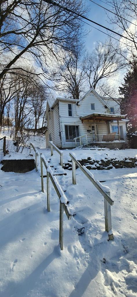 view of property with a porch