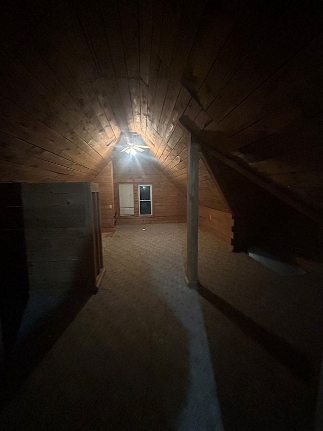 bonus room featuring wood walls, lofted ceiling, carpet, and wooden ceiling