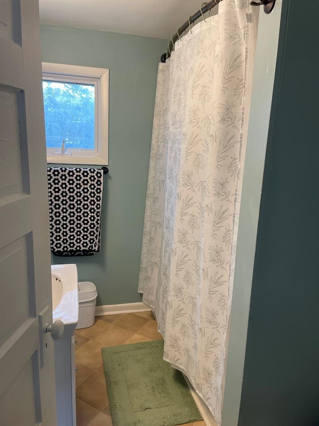 bathroom with tile patterned floors and vanity