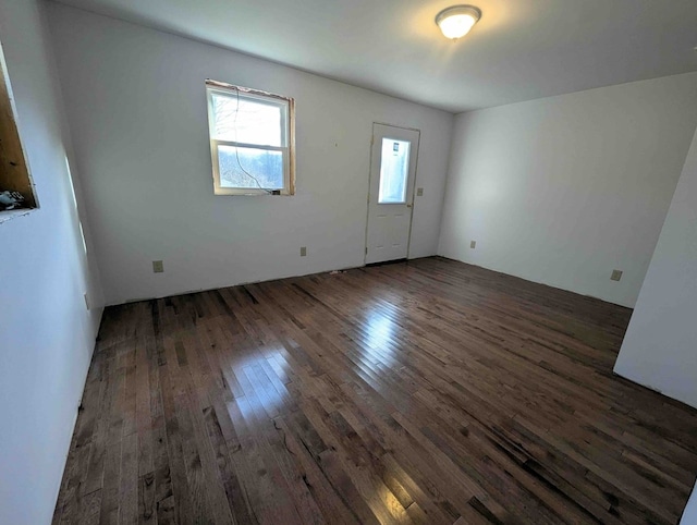 spare room with dark hardwood / wood-style flooring