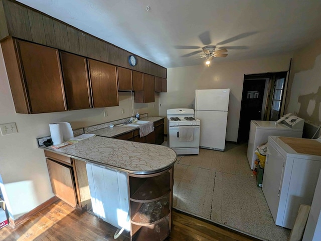 kitchen with ceiling fan, separate washer and dryer, kitchen peninsula, white appliances, and dark brown cabinets