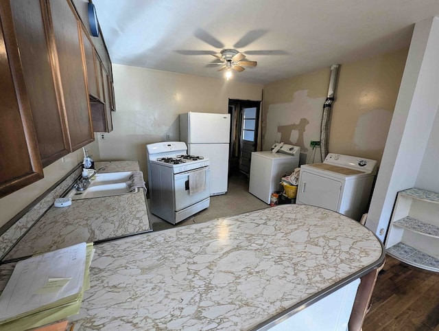 kitchen featuring ceiling fan, sink, white appliances, and light hardwood / wood-style flooring