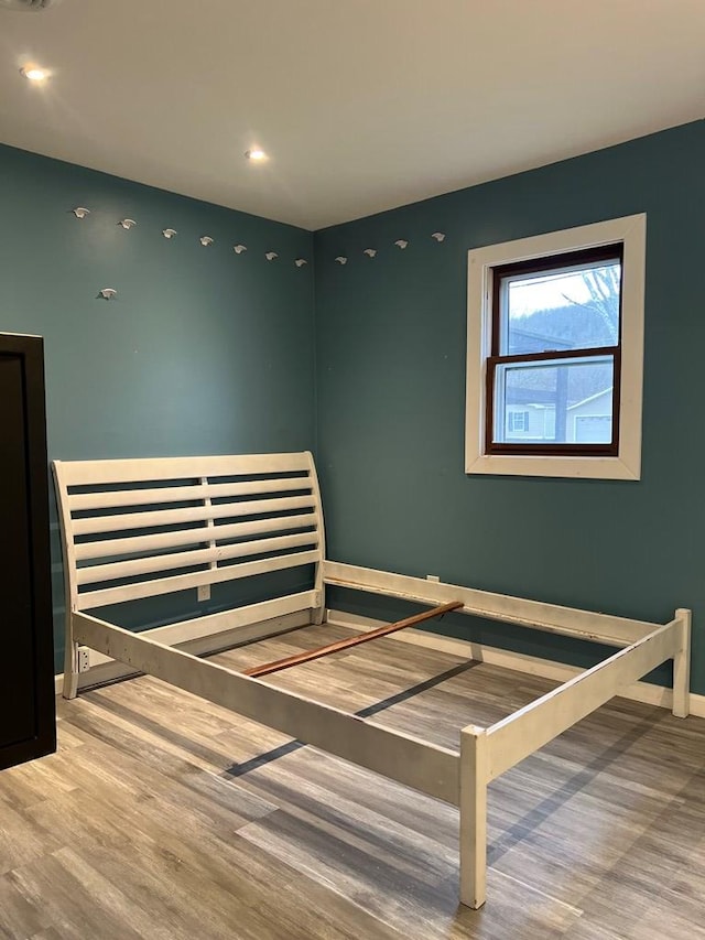 bedroom featuring hardwood / wood-style floors