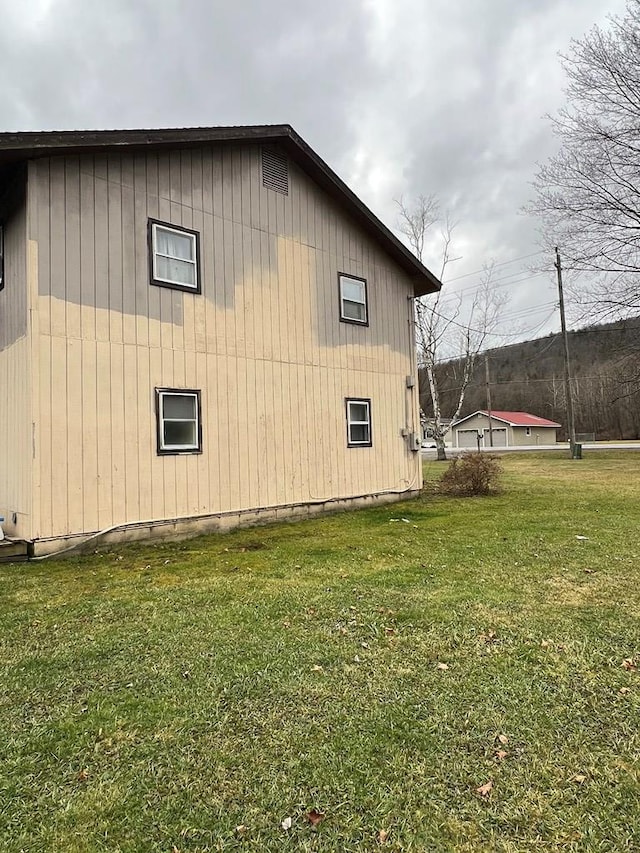 view of home's exterior featuring a yard