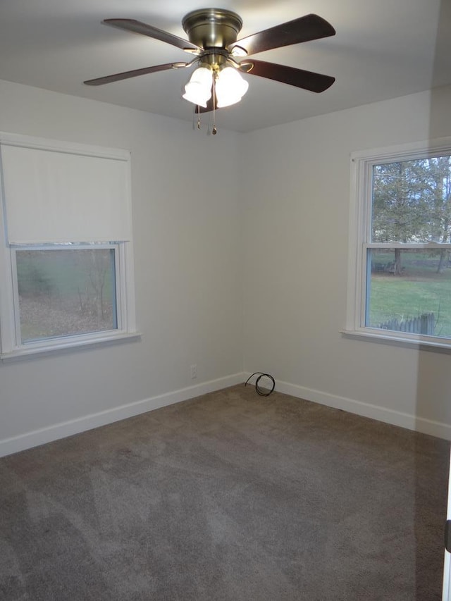 carpeted empty room featuring ceiling fan