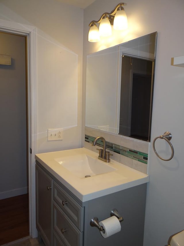 bathroom with vanity and backsplash