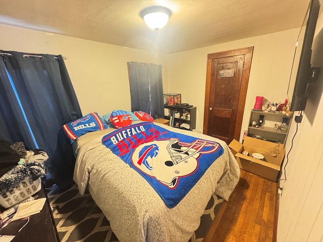 bedroom featuring dark wood-type flooring