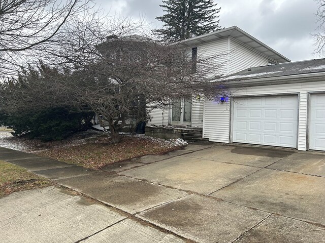 view of front of home with a garage