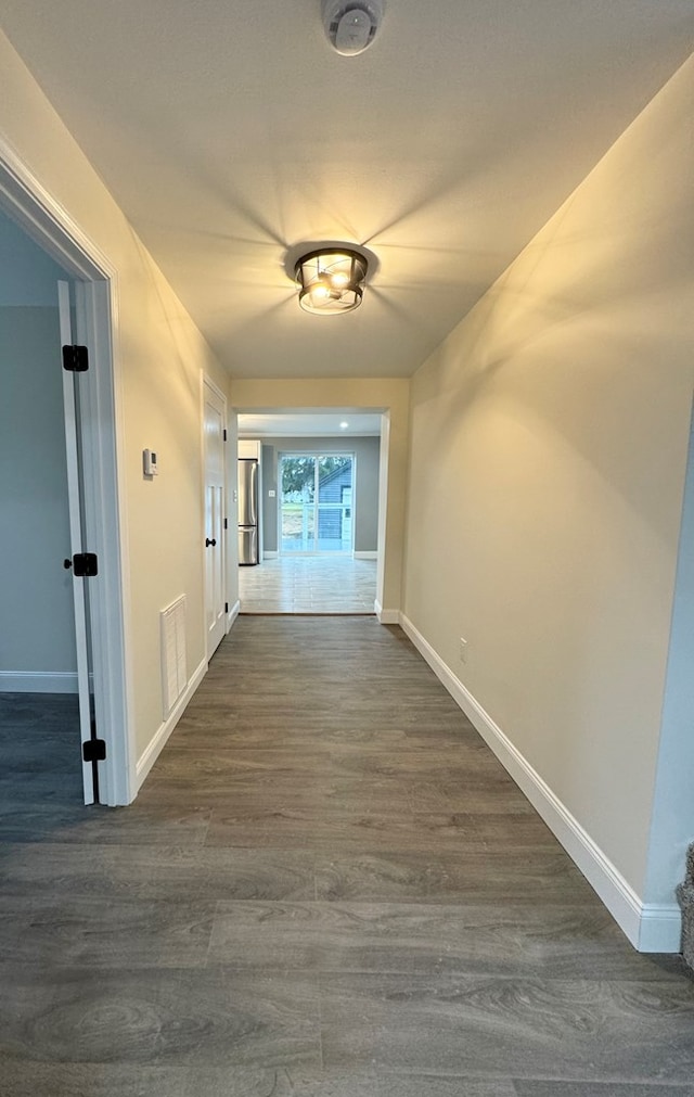 corridor with dark wood-type flooring