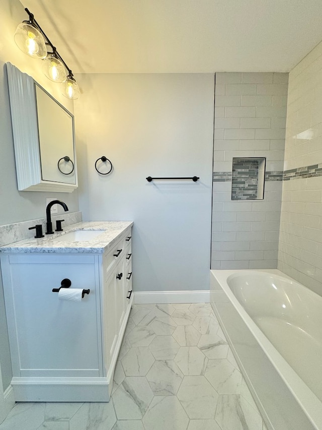 bathroom with vanity and a bath