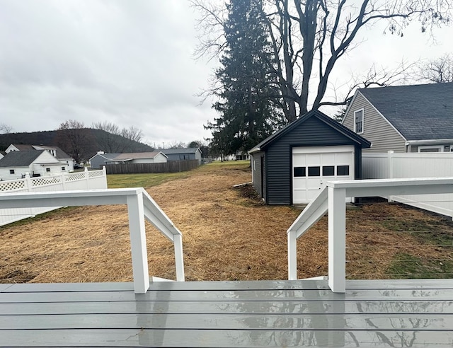 view of yard with an outbuilding and a garage