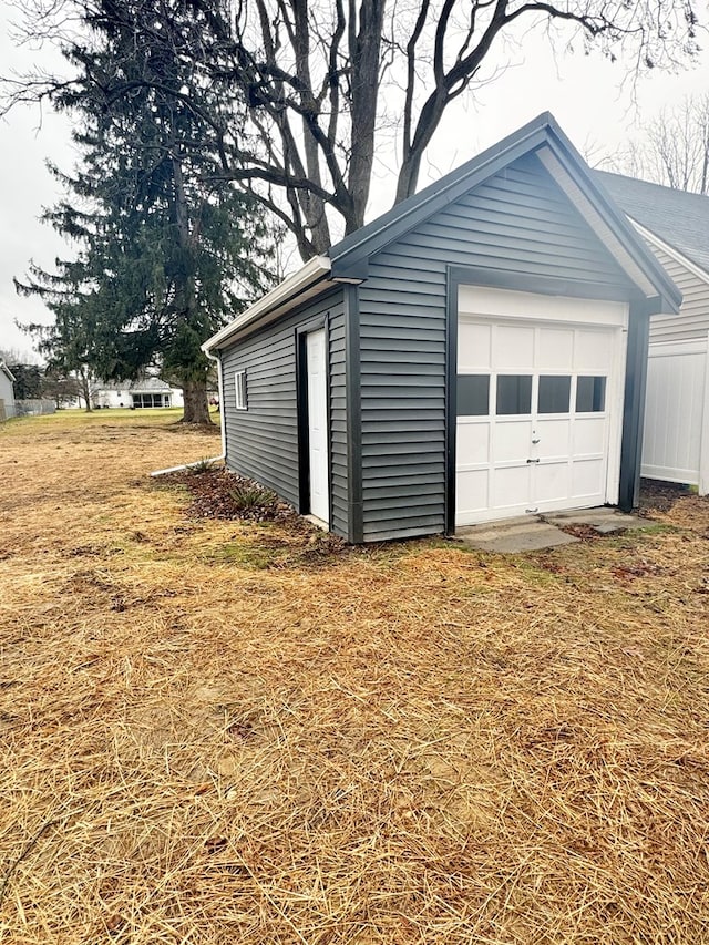 garage with a yard