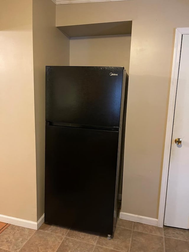 room details featuring black fridge