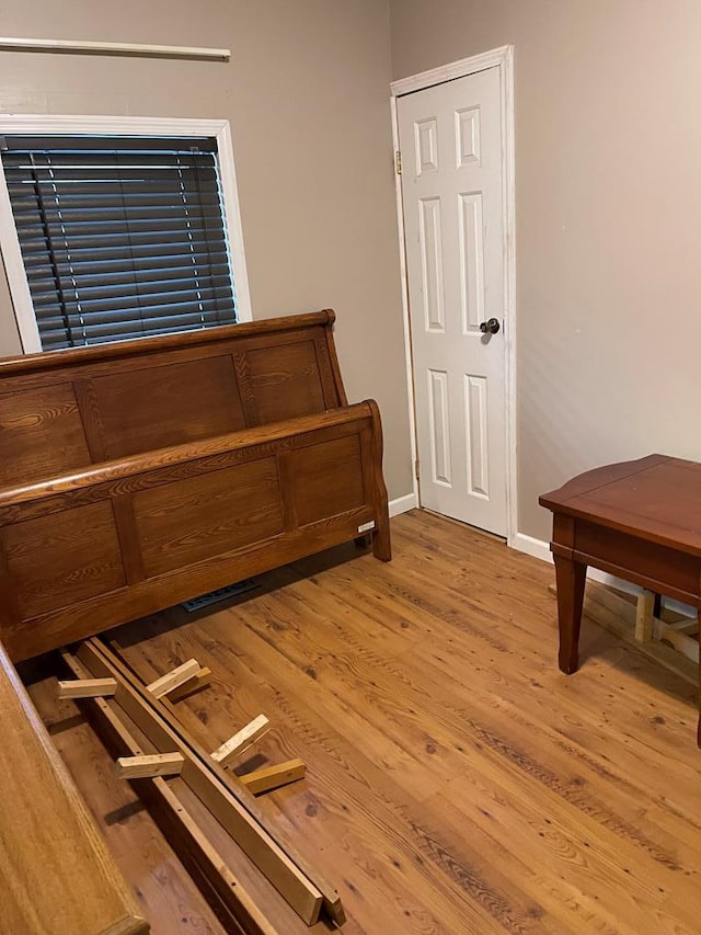 bedroom featuring hardwood / wood-style flooring