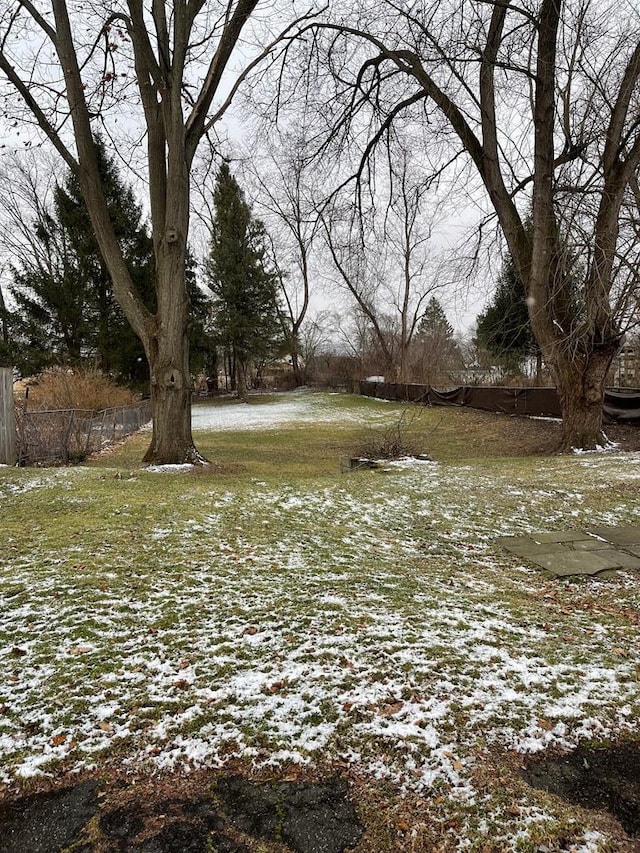 view of yard layered in snow