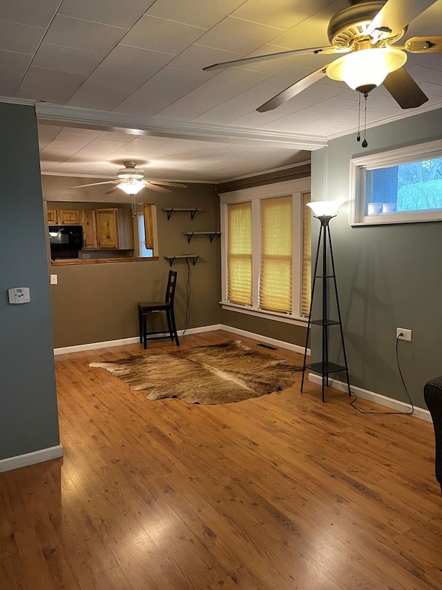 interior space featuring crown molding and wood-type flooring