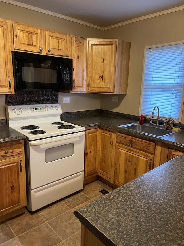 kitchen with electric range, crown molding, sink, and dark tile patterned flooring