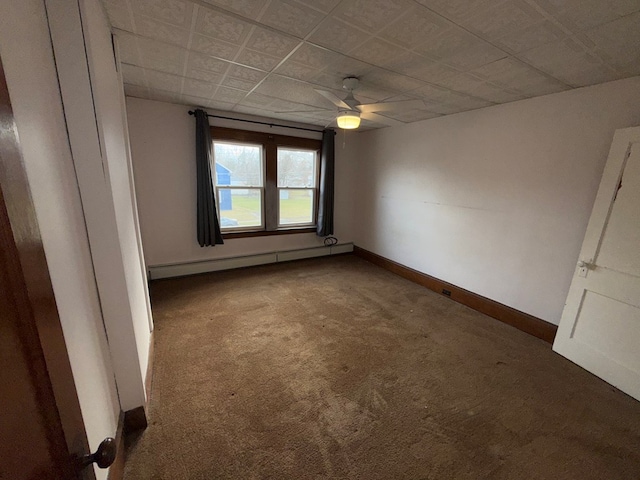 unfurnished room featuring carpet flooring, ceiling fan, and a baseboard radiator