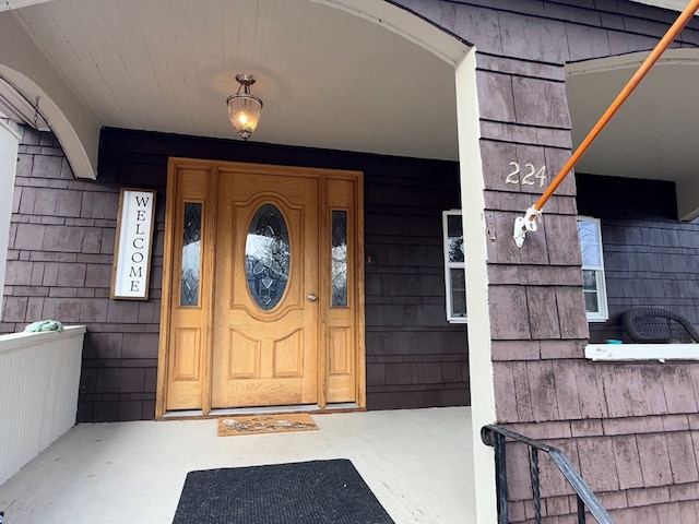 property entrance featuring covered porch