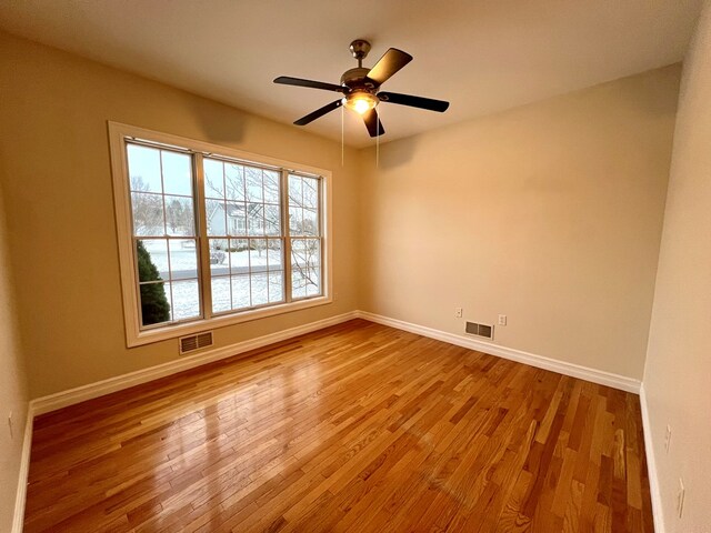 unfurnished room featuring ceiling fan and light hardwood / wood-style flooring