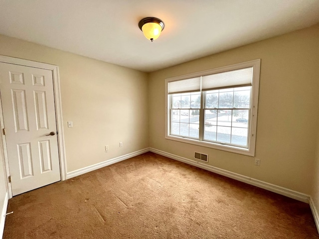 view of carpeted spare room