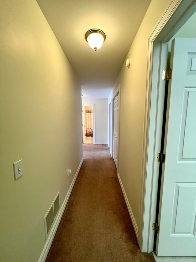 hall with carpet flooring