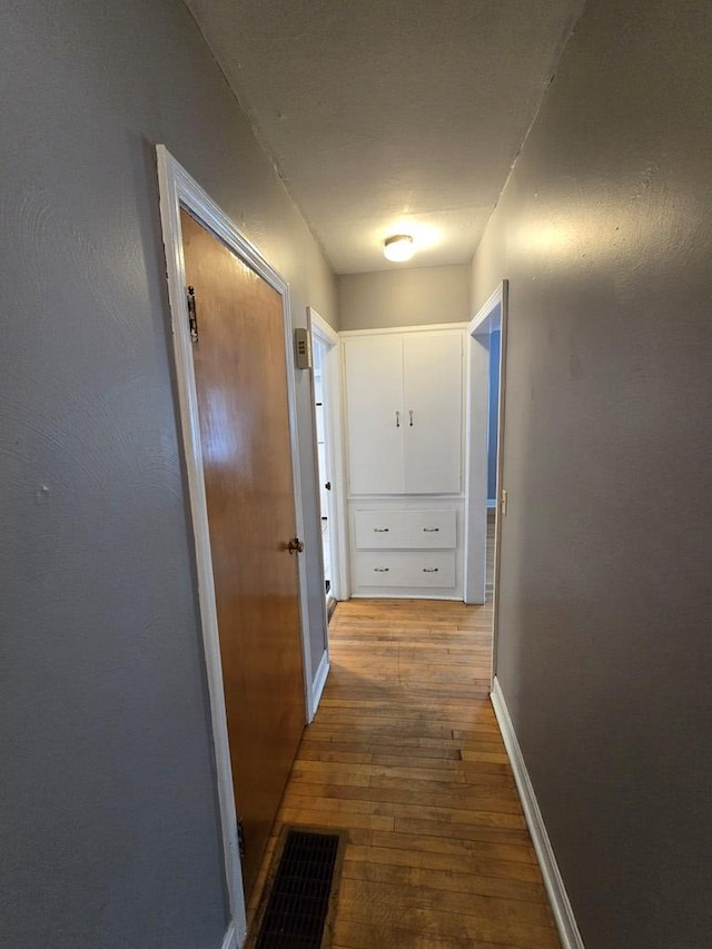 hallway featuring hardwood / wood-style floors