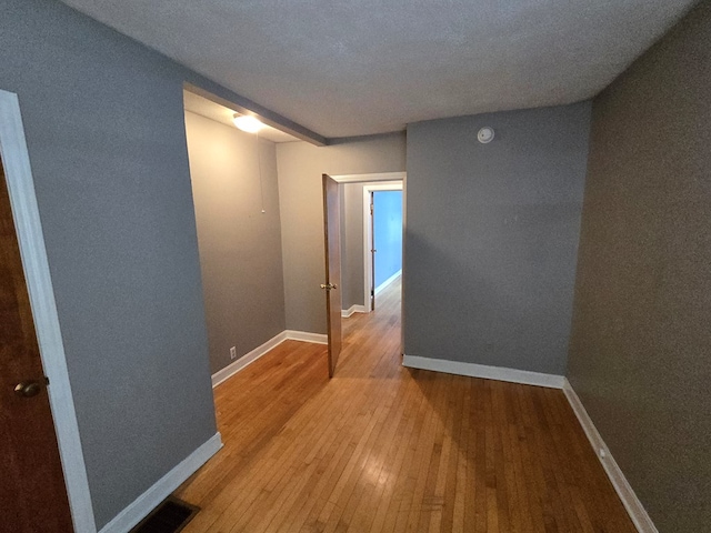 corridor featuring light hardwood / wood-style floors