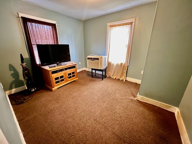 interior space featuring carpet floors and a wall unit AC