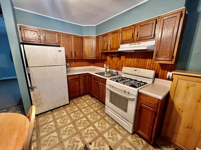 kitchen featuring sink and white appliances