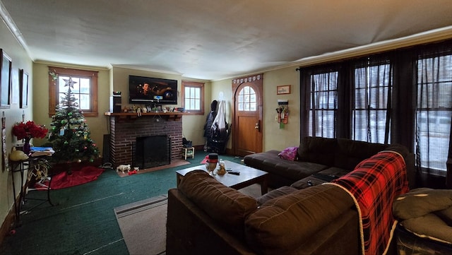 living room with ornamental molding, a fireplace, and carpet