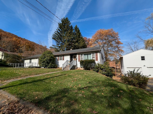 ranch-style house with a front lawn