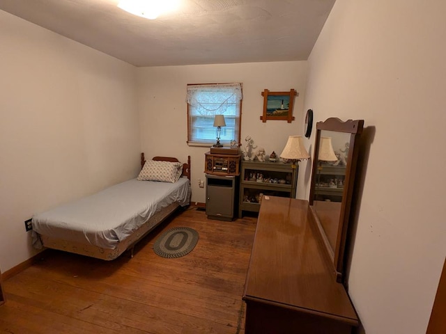 bedroom featuring dark wood-type flooring