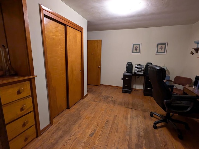 office with light hardwood / wood-style flooring