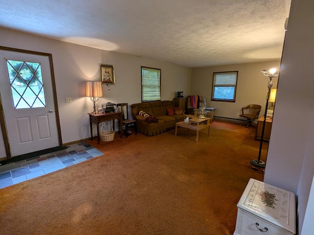 living room featuring carpet, a textured ceiling, and a baseboard heating unit