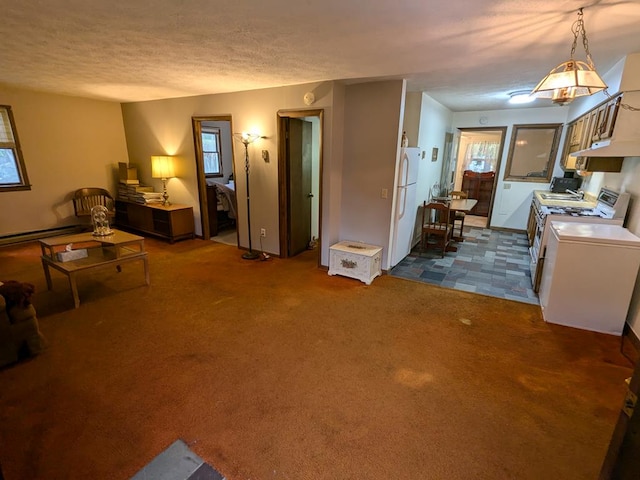 carpeted living room featuring a textured ceiling and a baseboard radiator