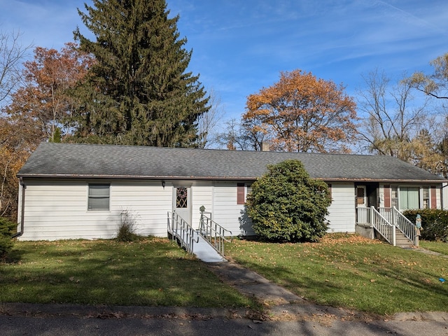 single story home featuring a front yard