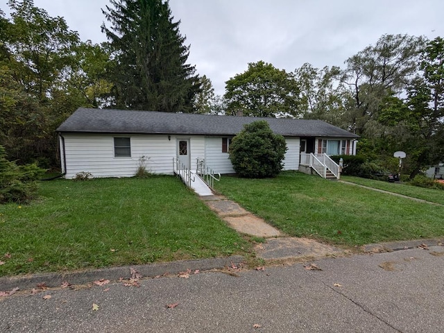 single story home with a front lawn