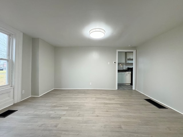 unfurnished room with light hardwood / wood-style flooring