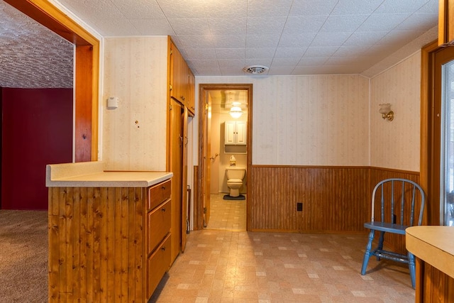 hall featuring wooden walls