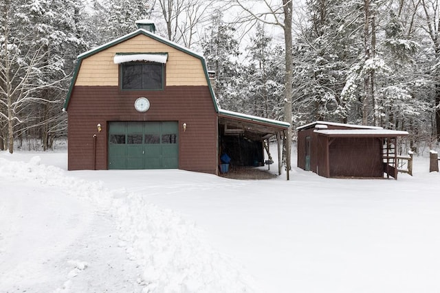 view of snow covered garage