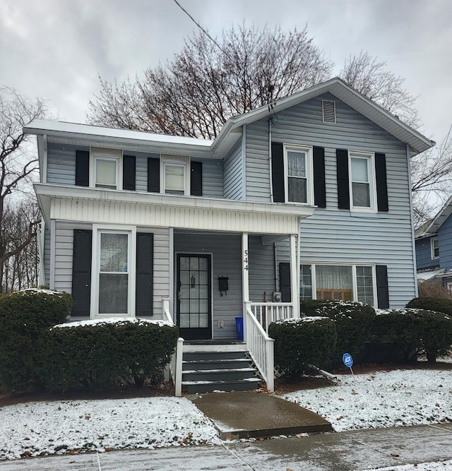 view of front property featuring covered porch