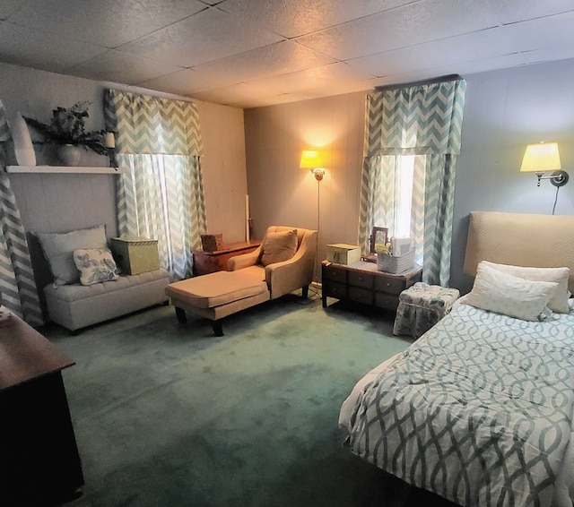 carpeted bedroom with a fireplace