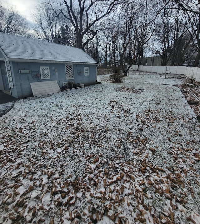 view of yard layered in snow